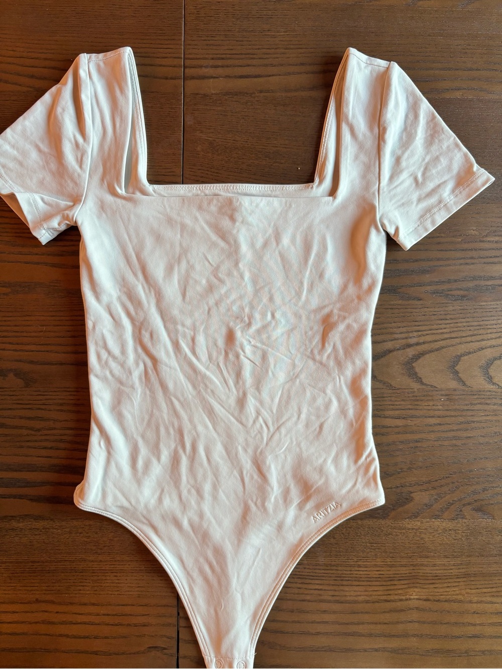 Aritzia Contour bodysuit 

The colour is matte pearl